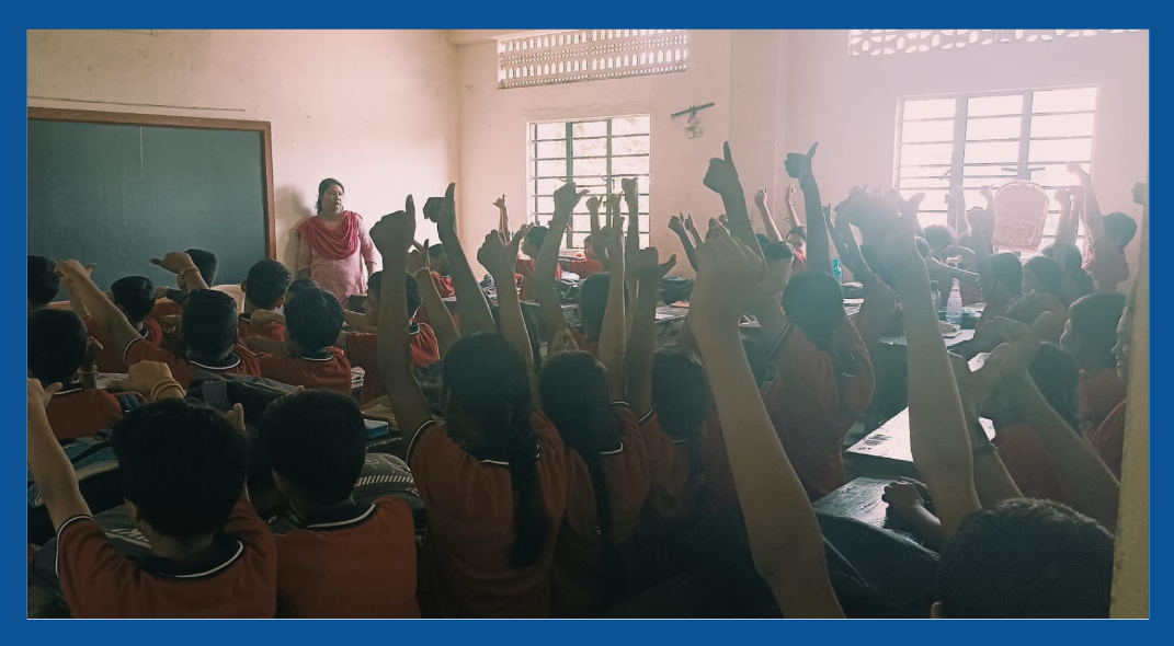 Students raising hands — the energy of Day 0